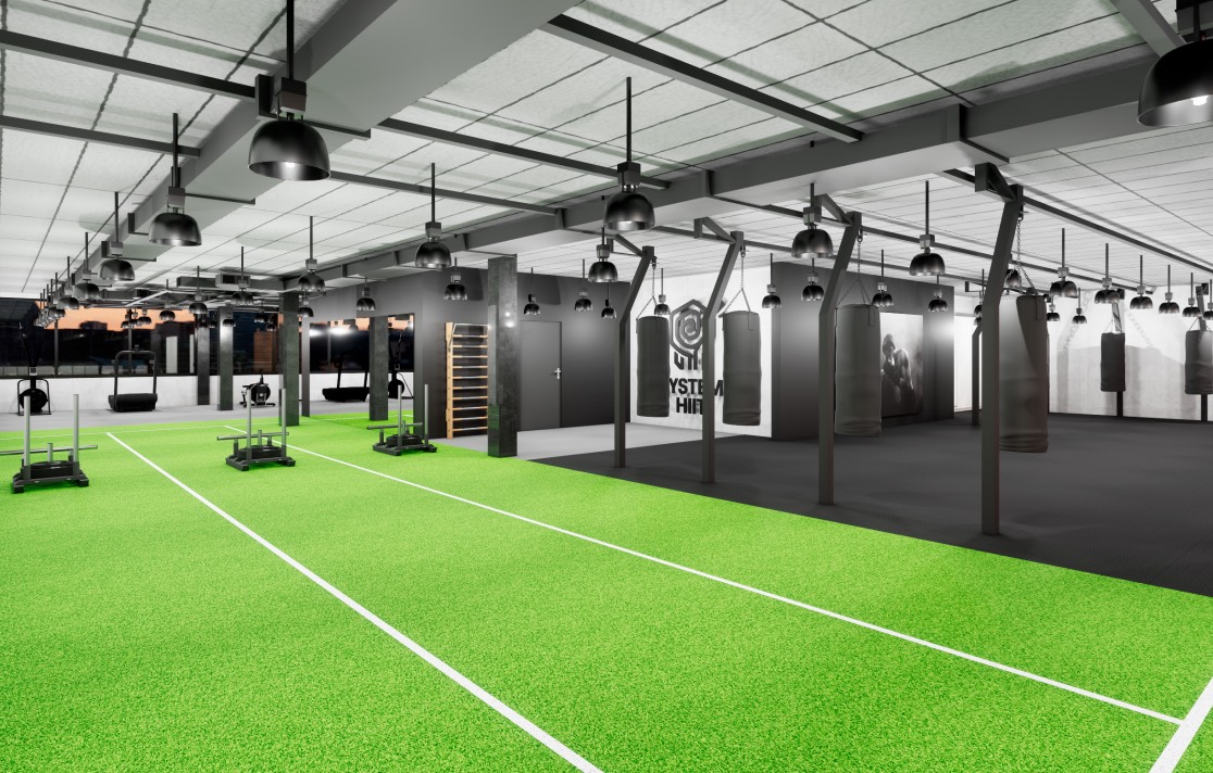 Visuel 3D de l’intérieur du studio System HIIT : surface de cross training en gazon synthétique et sacs de frappe le long du mur